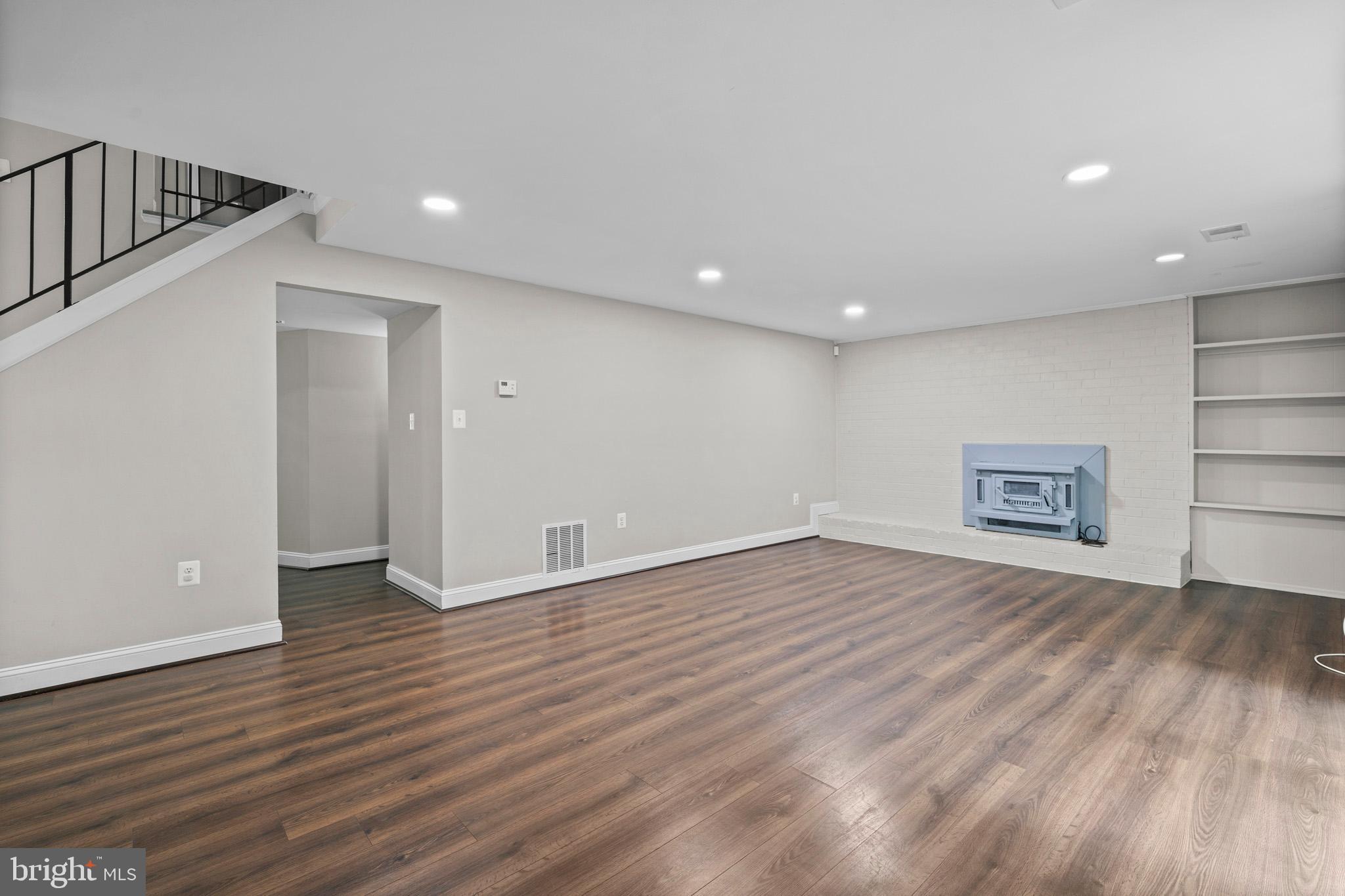 5908 Michael Road Waldorf, MD 20601 - Photo 33 of 44 a view of an empty room with wooden floor and a window