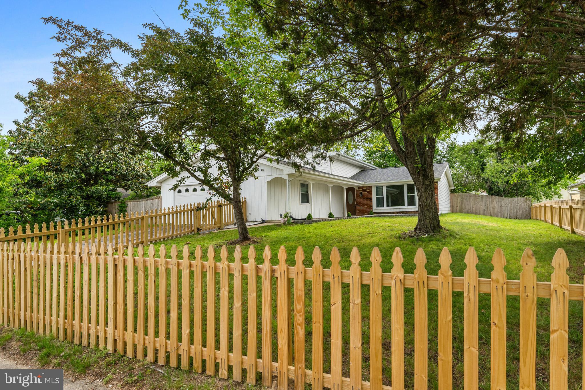 5908 Michael Road Waldorf, MD 20601 - Photo 5 of 44 a front view of a house with a garden