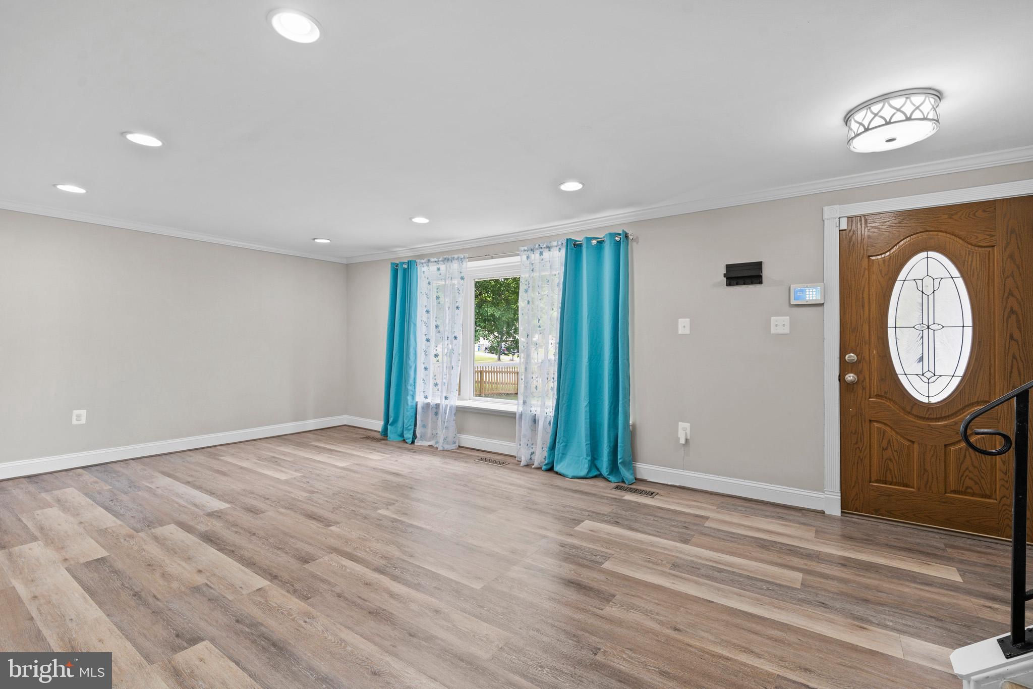 5908 Michael Road Waldorf, MD 20601 - Photo 7 of 44 a view of a room with wooden floor and white walls