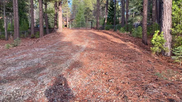 a backyard of a house with lots of green space