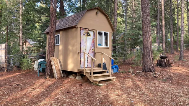 a house with trees in the background