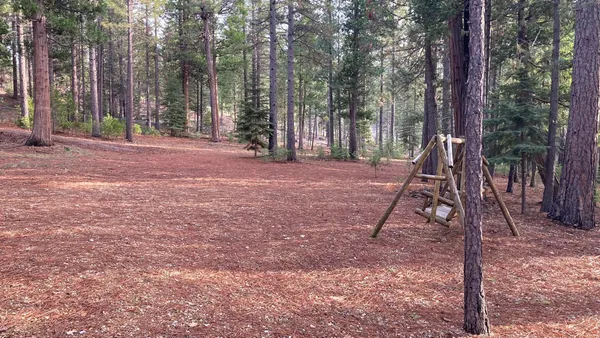 a backyard of a house with lots of green space