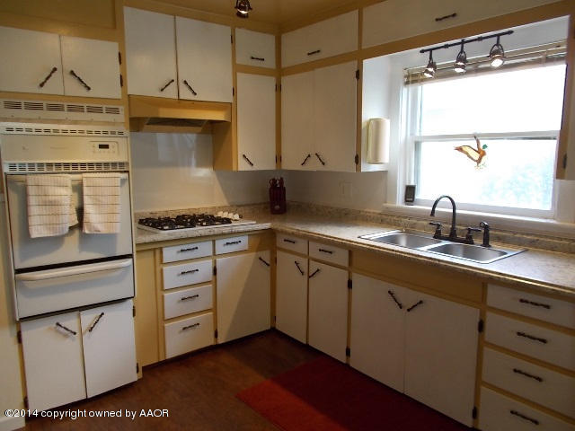 501 2nd Street Groom, TX 79039 - Photo 5 of 19 a kitchen with granite countertop a sink cabinets and window