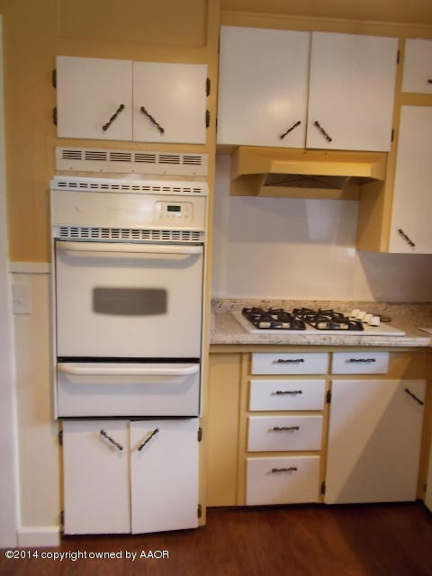 501 2nd Street Groom, TX 79039 - Photo 7 of 19 a stove top oven sitting inside of a kitchen