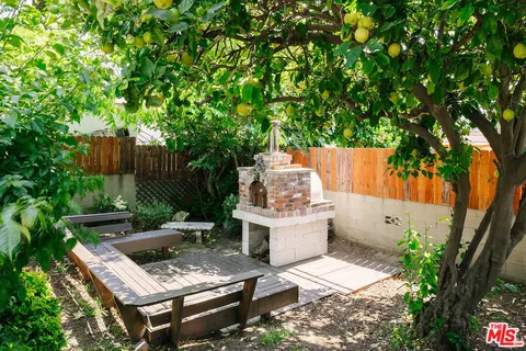 a view of a backyard with sitting area
