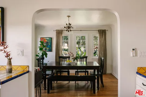 a view of a dining room with furniture and window