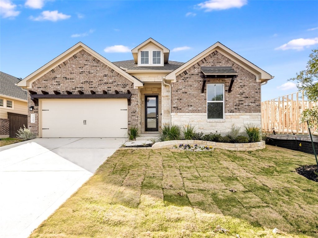2205 Ringstaff Road Leander, TX 78641 - Photo 1 of 1 a front view of a house with a yard