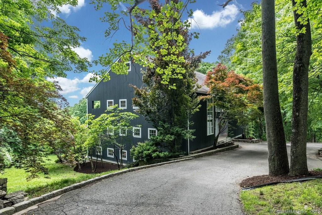 58 Wells Hill Road Weston, CT 06883 - Photo 1 of 38 an outdoor view having patio