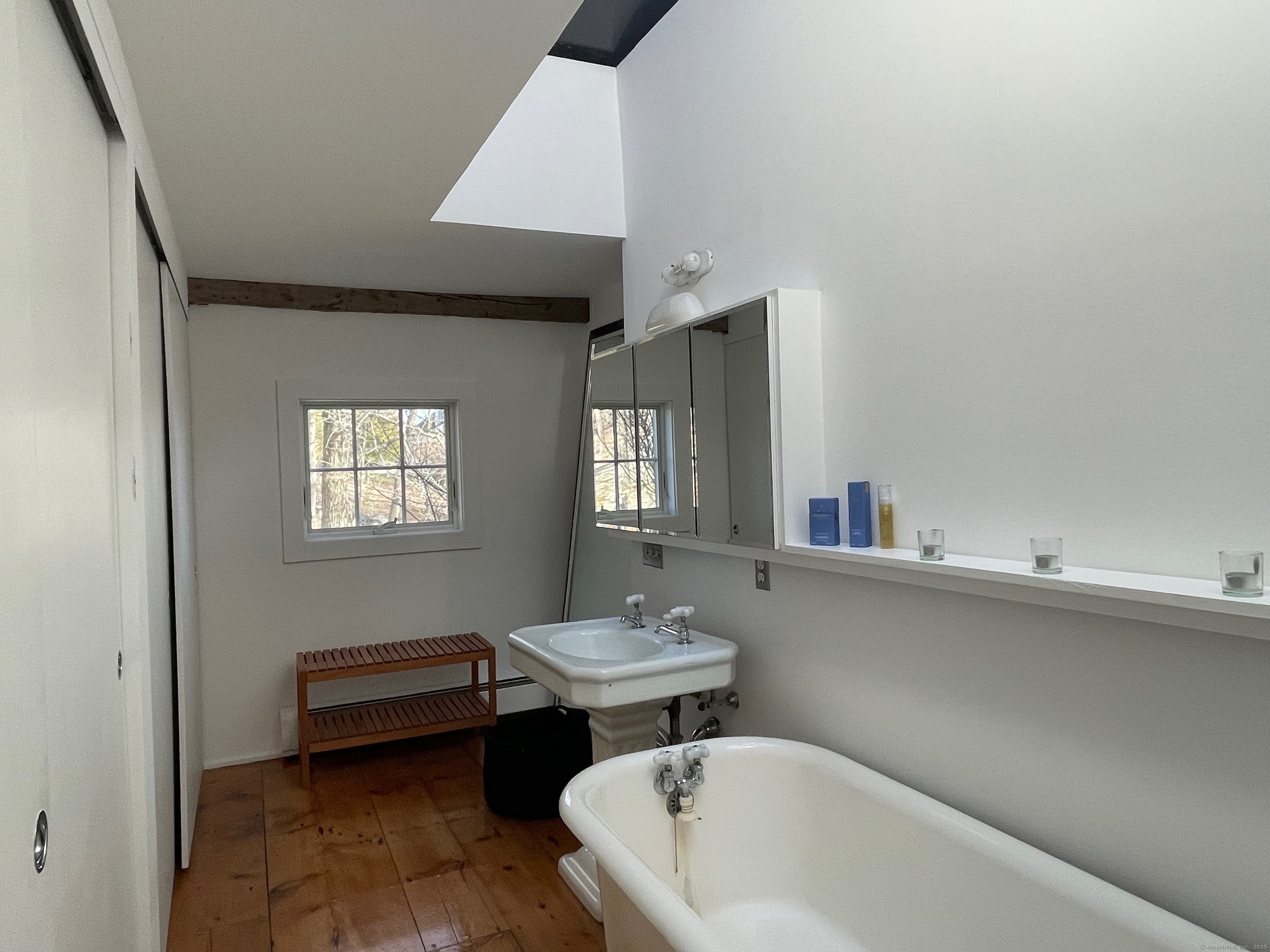 58 Wells Hill Road Weston, CT 06883 - Photo 21 of 38 a bathroom with a sink and a bathtub