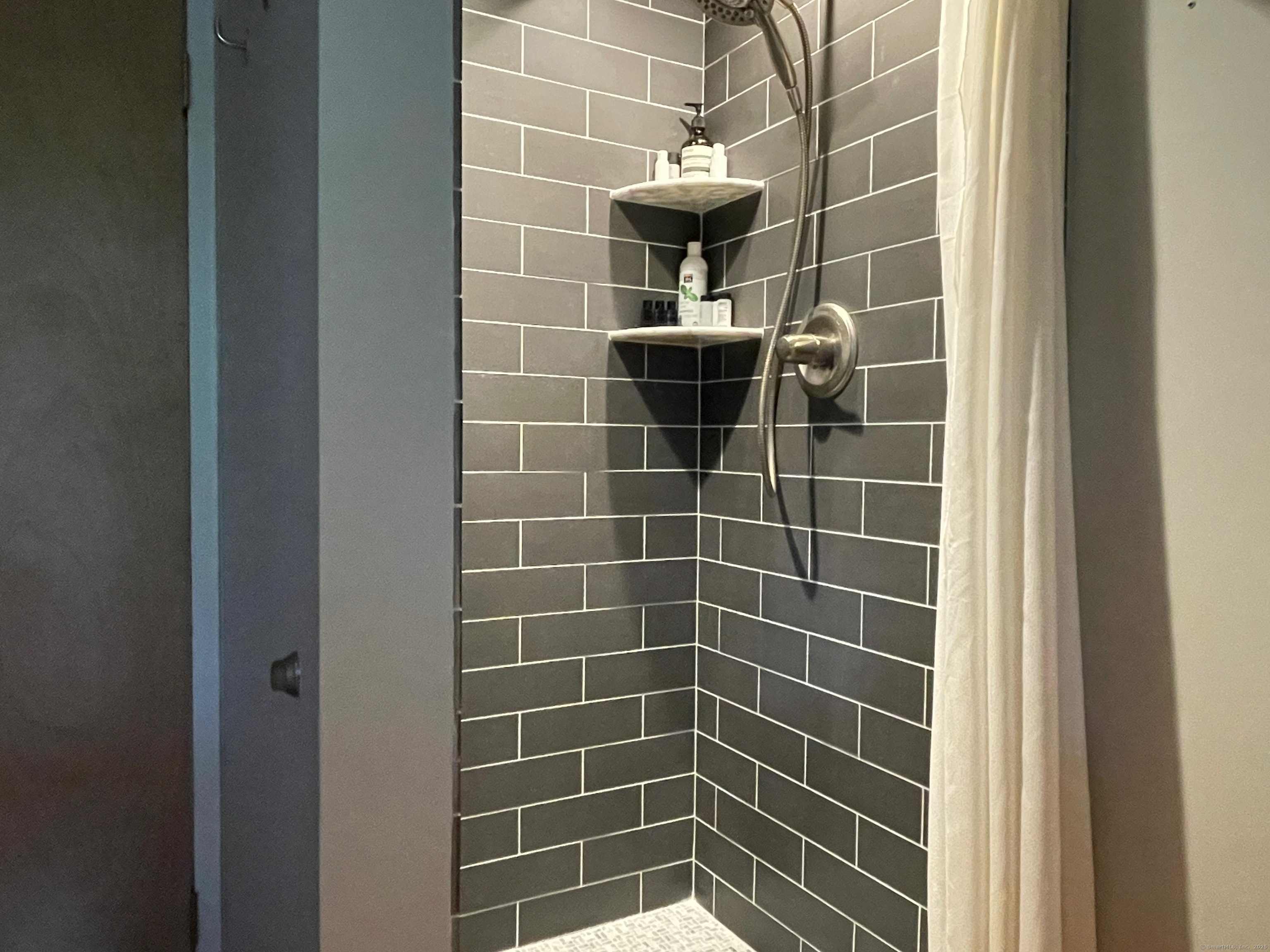 58 Wells Hill Road Weston, CT 06883 - Photo 22 of 38 a bathroom with a shower