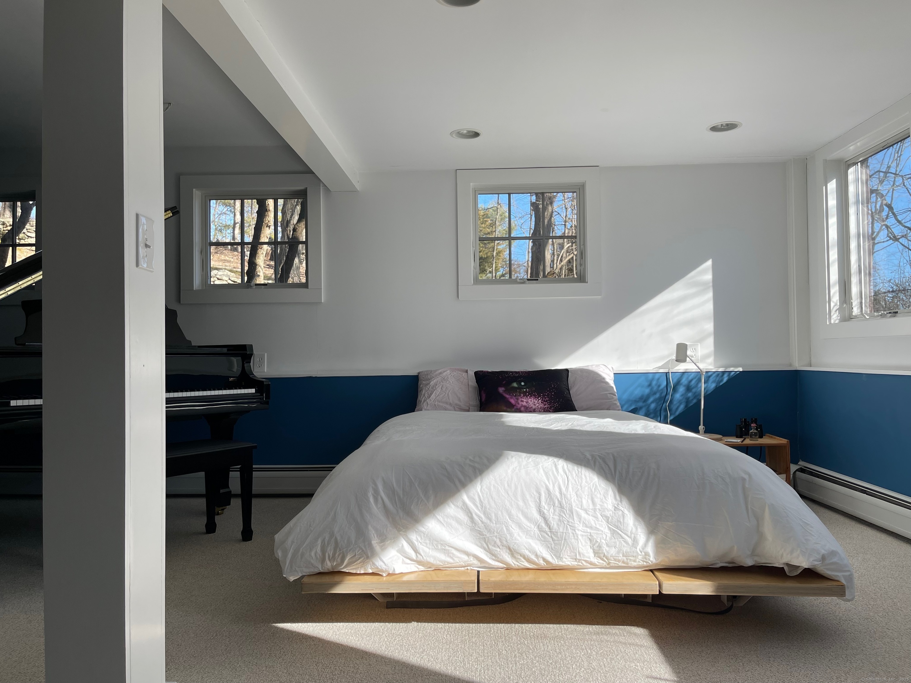 58 Wells Hill Road Weston, CT 06883 - Photo 26 of 38 a bedroom with a bed and a night stand