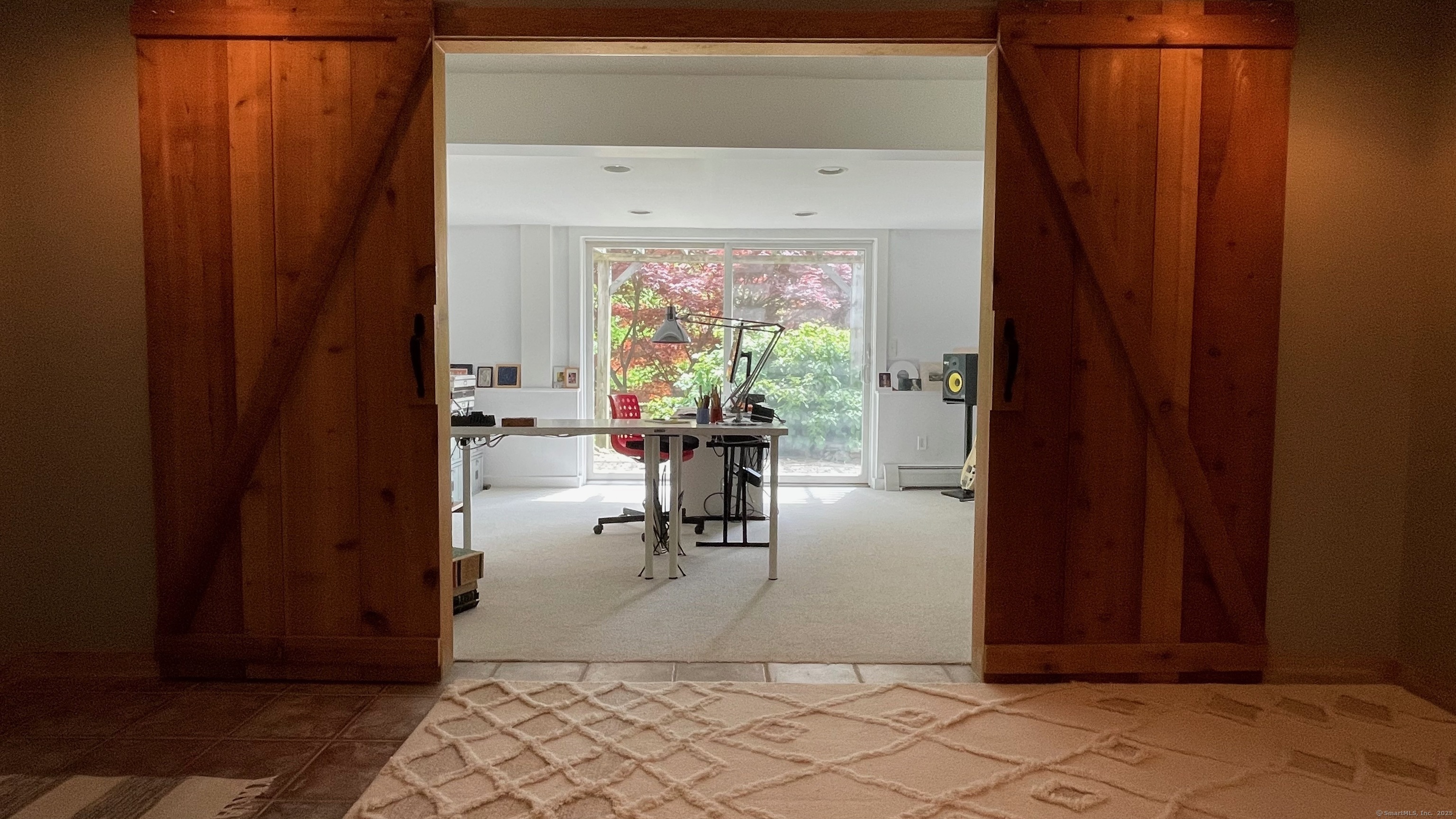 58 Wells Hill Road Weston, CT 06883 - Photo 28 of 38 a living room with a table and a window