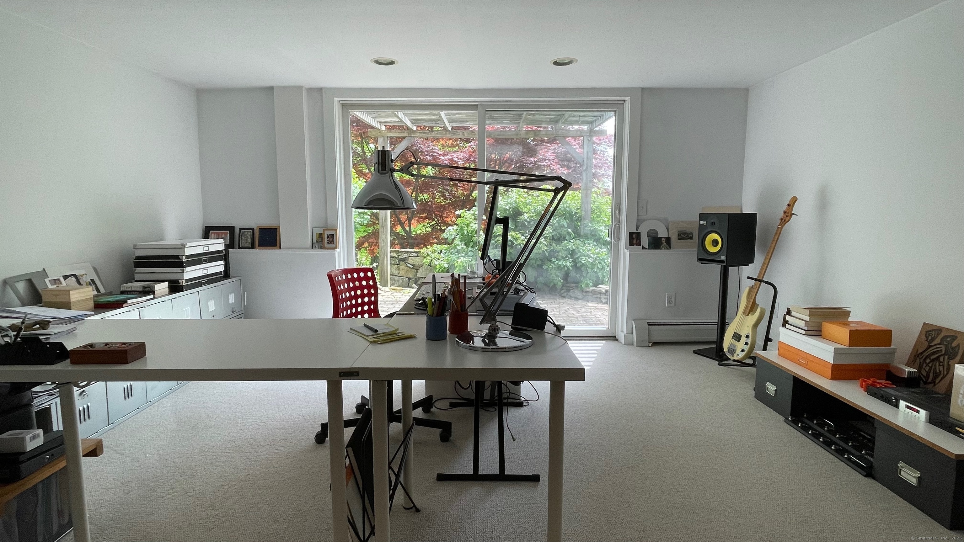 58 Wells Hill Road Weston, CT 06883 - Photo 29 of 38 a view of a workspace with furniture and a window