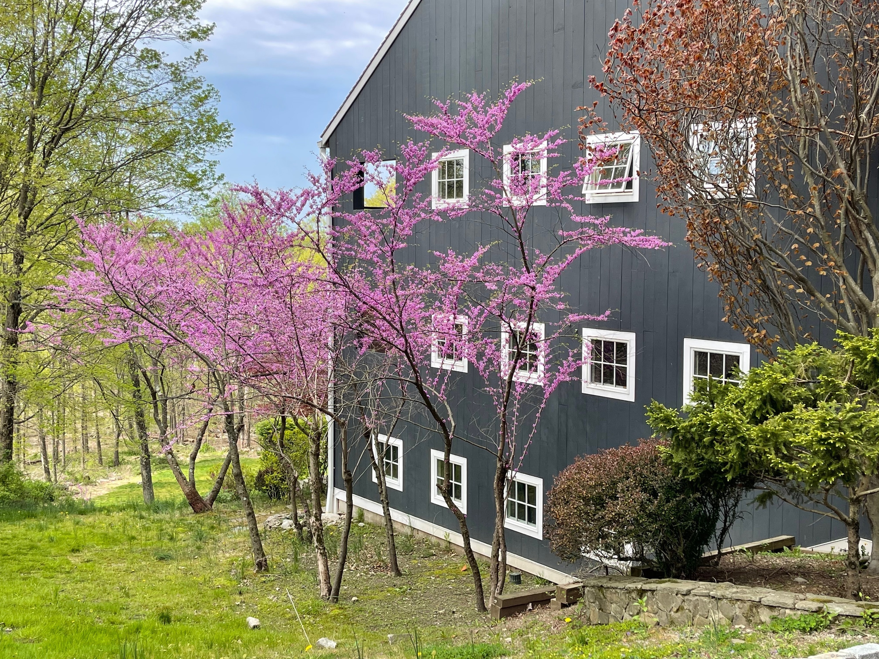 58 Wells Hill Road Weston, CT 06883 - Photo 31 of 38 a front view of house with yard