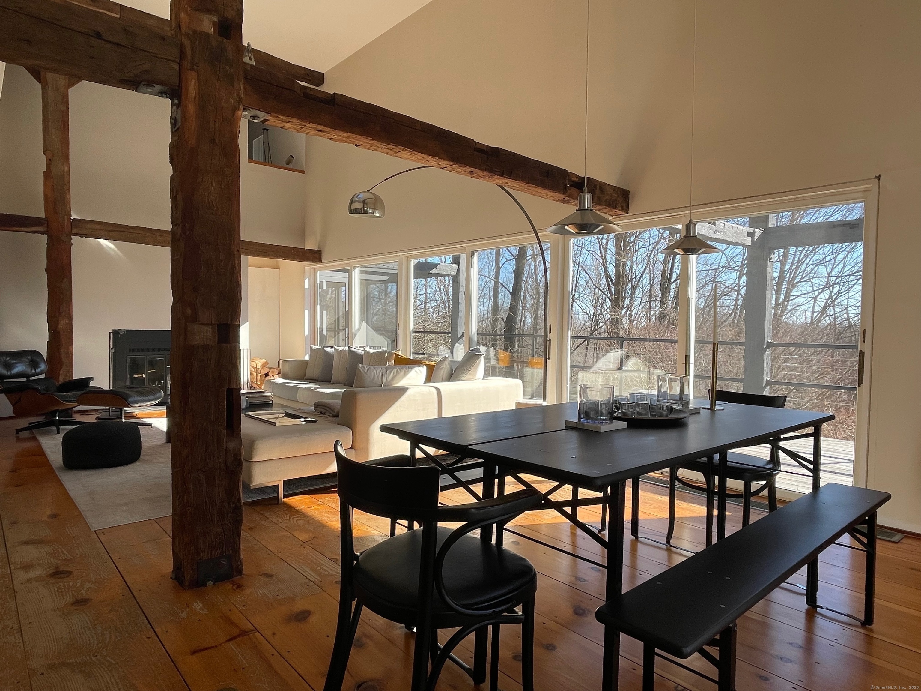 58 Wells Hill Road Weston, CT 06883 - Photo 7 of 38 a view of a dining room with furniture and wooden floor