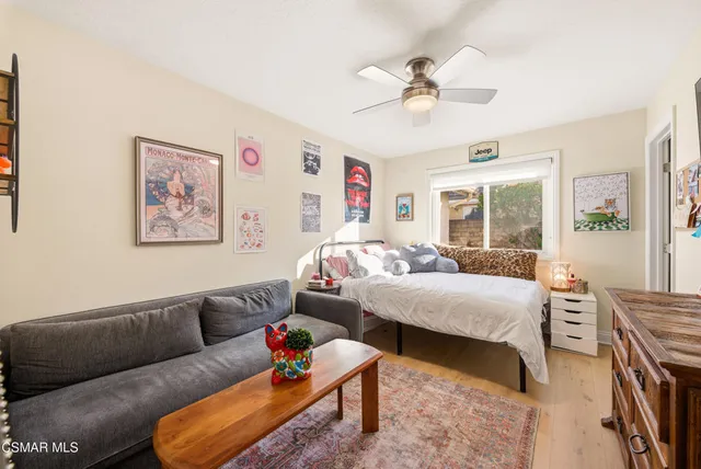 a view of a livingroom with furniture and workspace