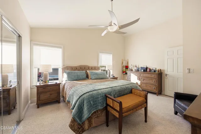 a bathroom with a double vanity sink mirror and shower