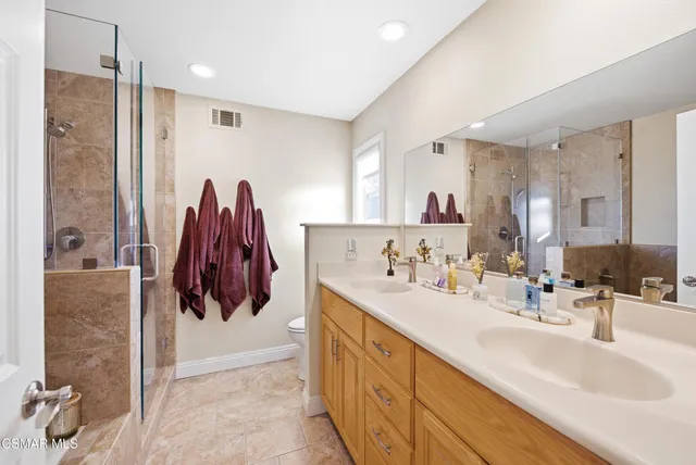 a bathroom with a tub and shower
