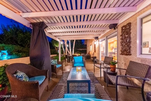 a view of a chairs and table in the patio