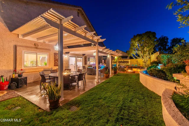 a view of a patio with a table chairs and a patio