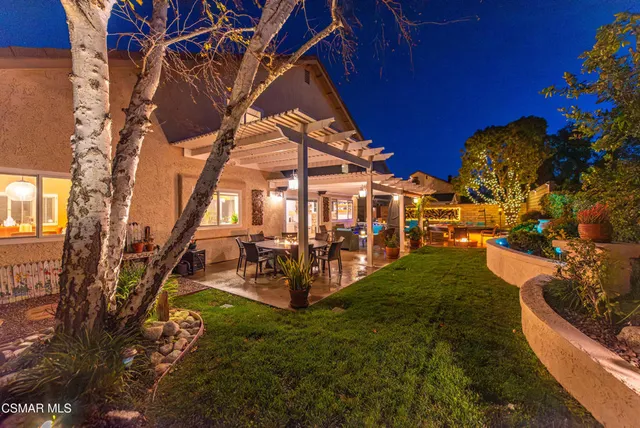 a view of a couches in patio of back yard
