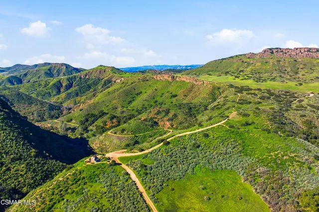 an aerial view of residential houses and outdoor space