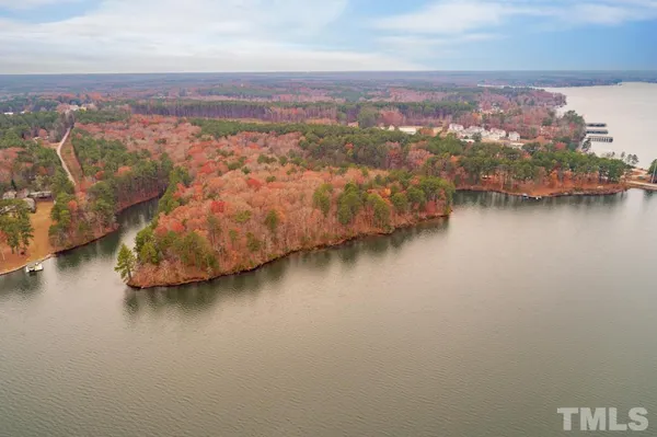 an aerial view of residential building with outdoor space and lake view