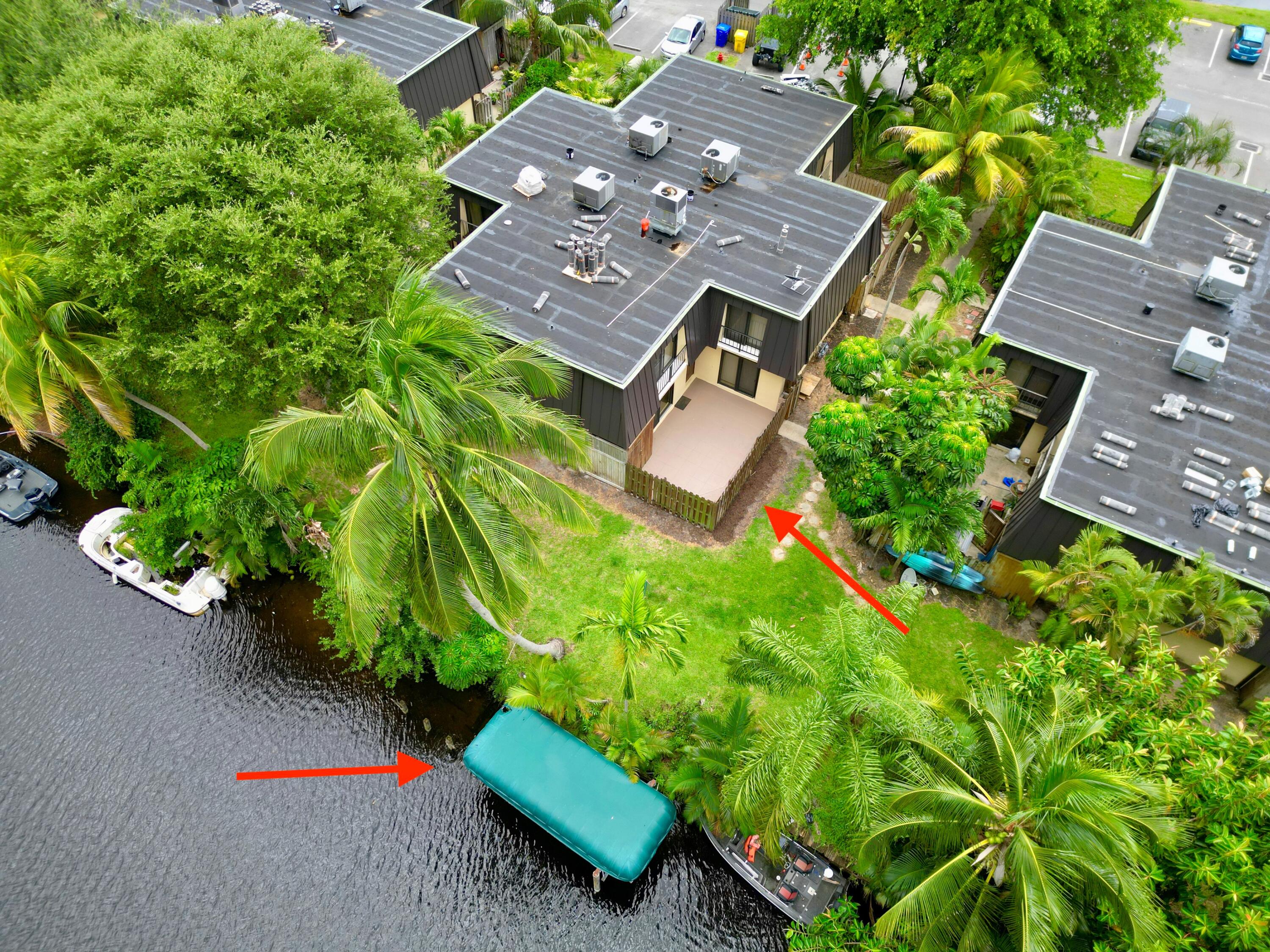 2438 Waterside Drive Lake Worth, FL 33461 - Photo 2 of 26 an aerial view of a house with yard
