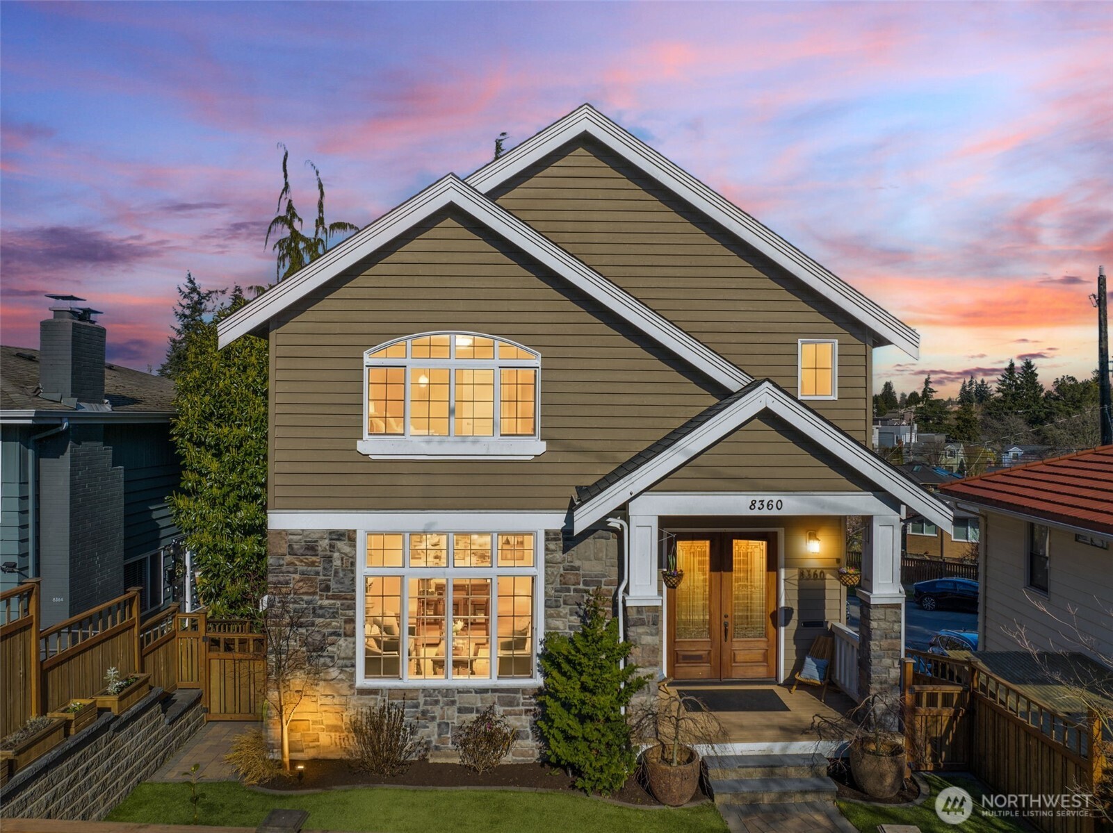 8360 Loyal Way Northwest Seattle, WA 98117 - Photo 1 of 36 a front view of a house with garden