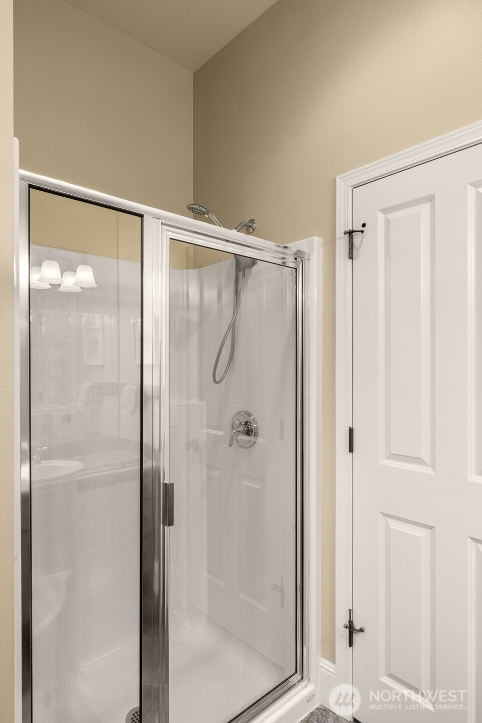 8360 Loyal Way Northwest Seattle, WA 98117 - Photo 14 of 36 a bathroom with a glass shower door