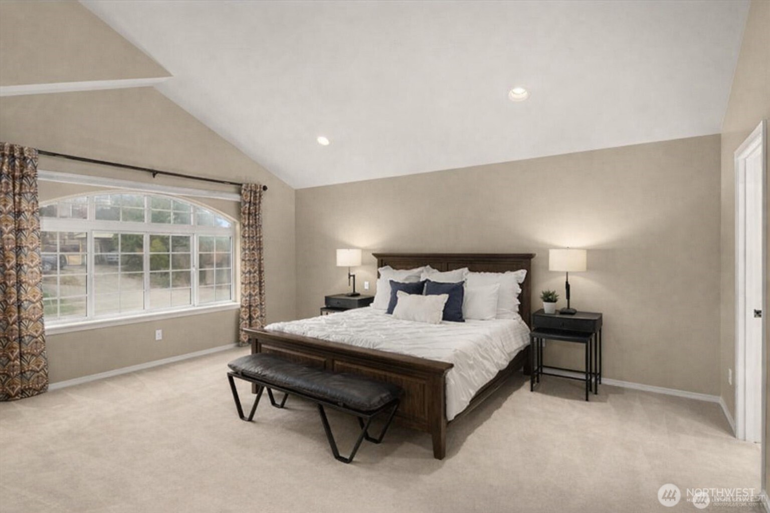 8360 Loyal Way Northwest Seattle, WA 98117 - Photo 16 of 36 a bedroom with a bed and a window