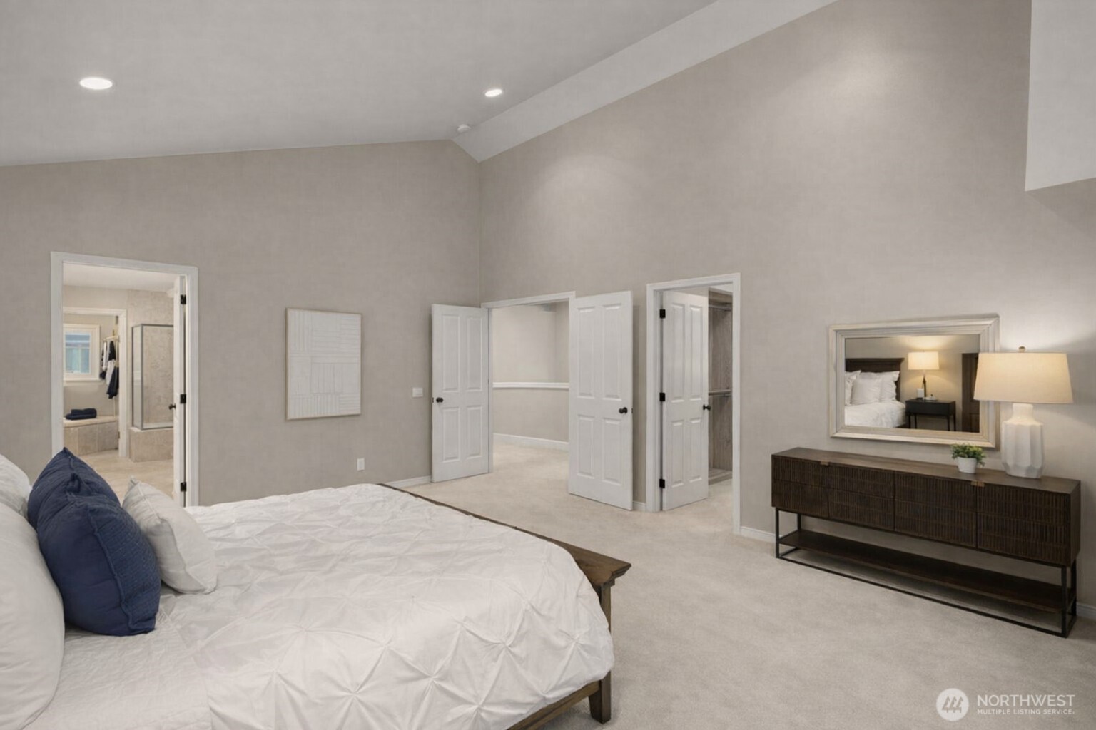 8360 Loyal Way Northwest Seattle, WA 98117 - Photo 17 of 36 a bedroom with a bed and a chandelier