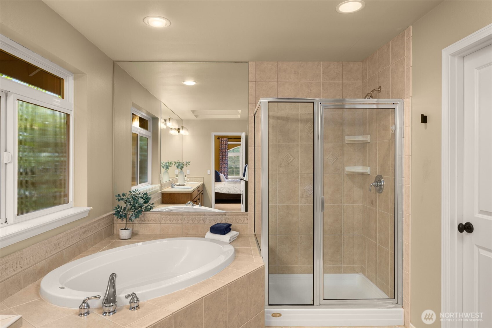 8360 Loyal Way Northwest Seattle, WA 98117 - Photo 21 of 36 a bathroom with a tub shower and sink