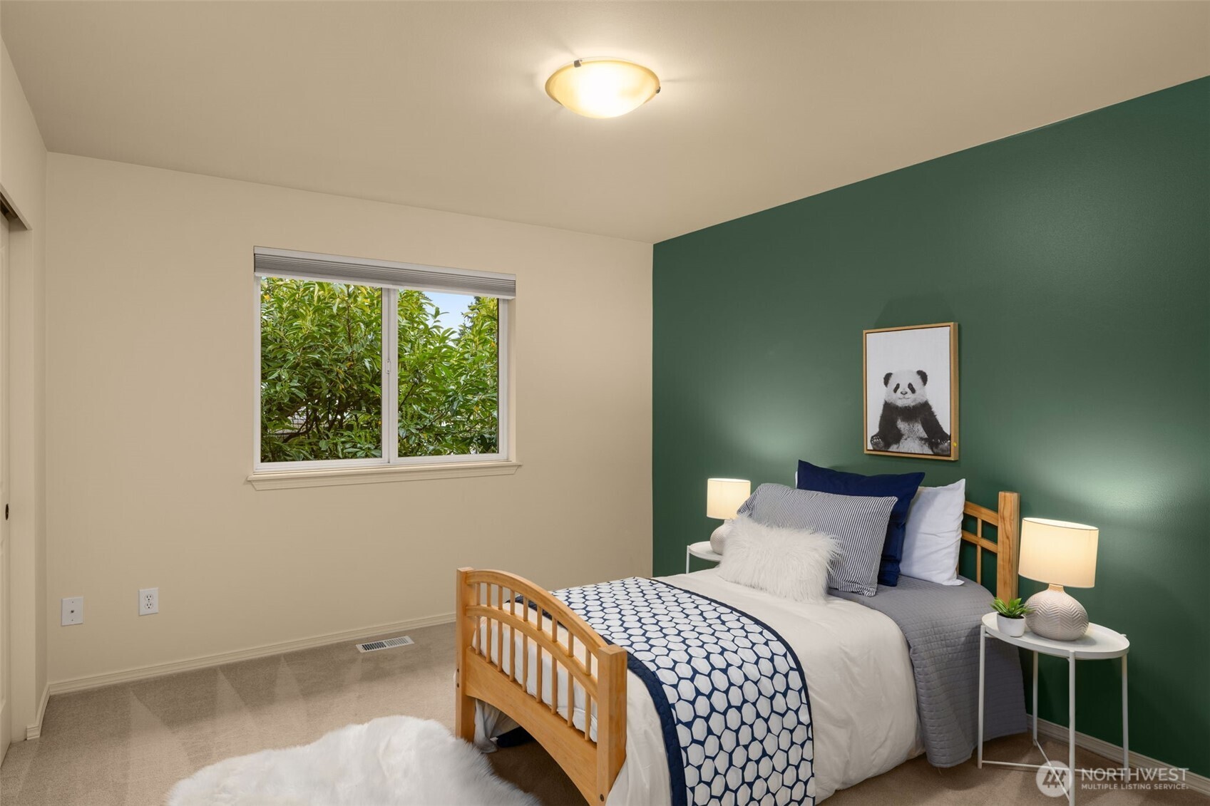 8360 Loyal Way Northwest Seattle, WA 98117 - Photo 22 of 36 a bedroom with a bed and a lamp
