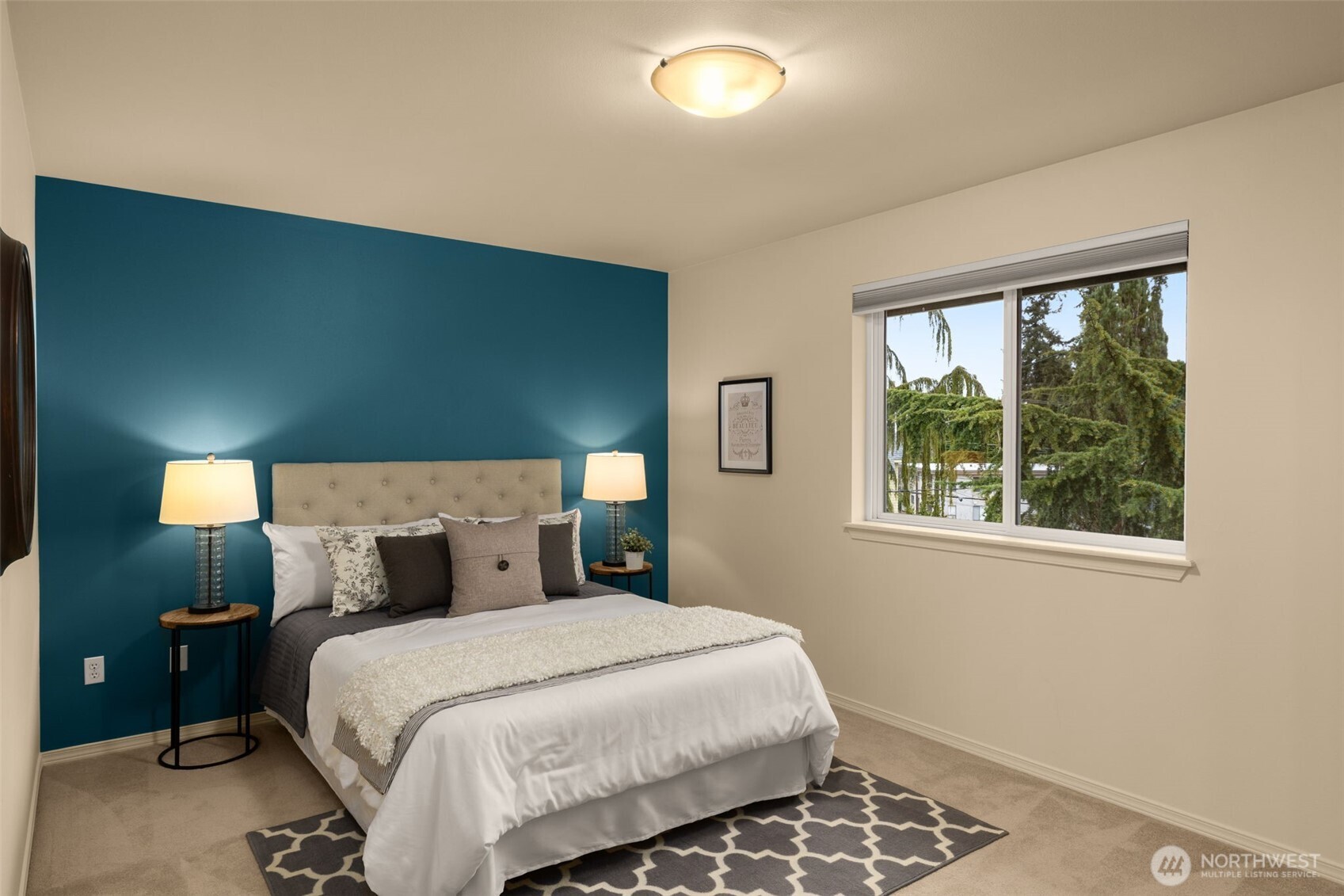 8360 Loyal Way Northwest Seattle, WA 98117 - Photo 24 of 36 a bedroom with a bed and a night stand