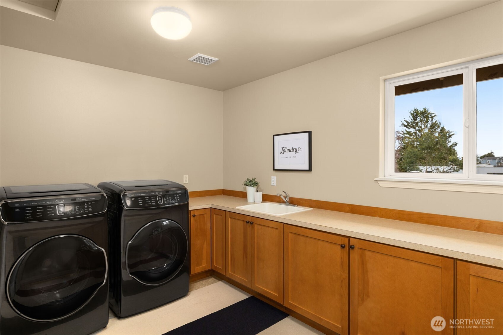 8360 Loyal Way Northwest Seattle, WA 98117 - Photo 25 of 36 a utility room with sink dryer and washer