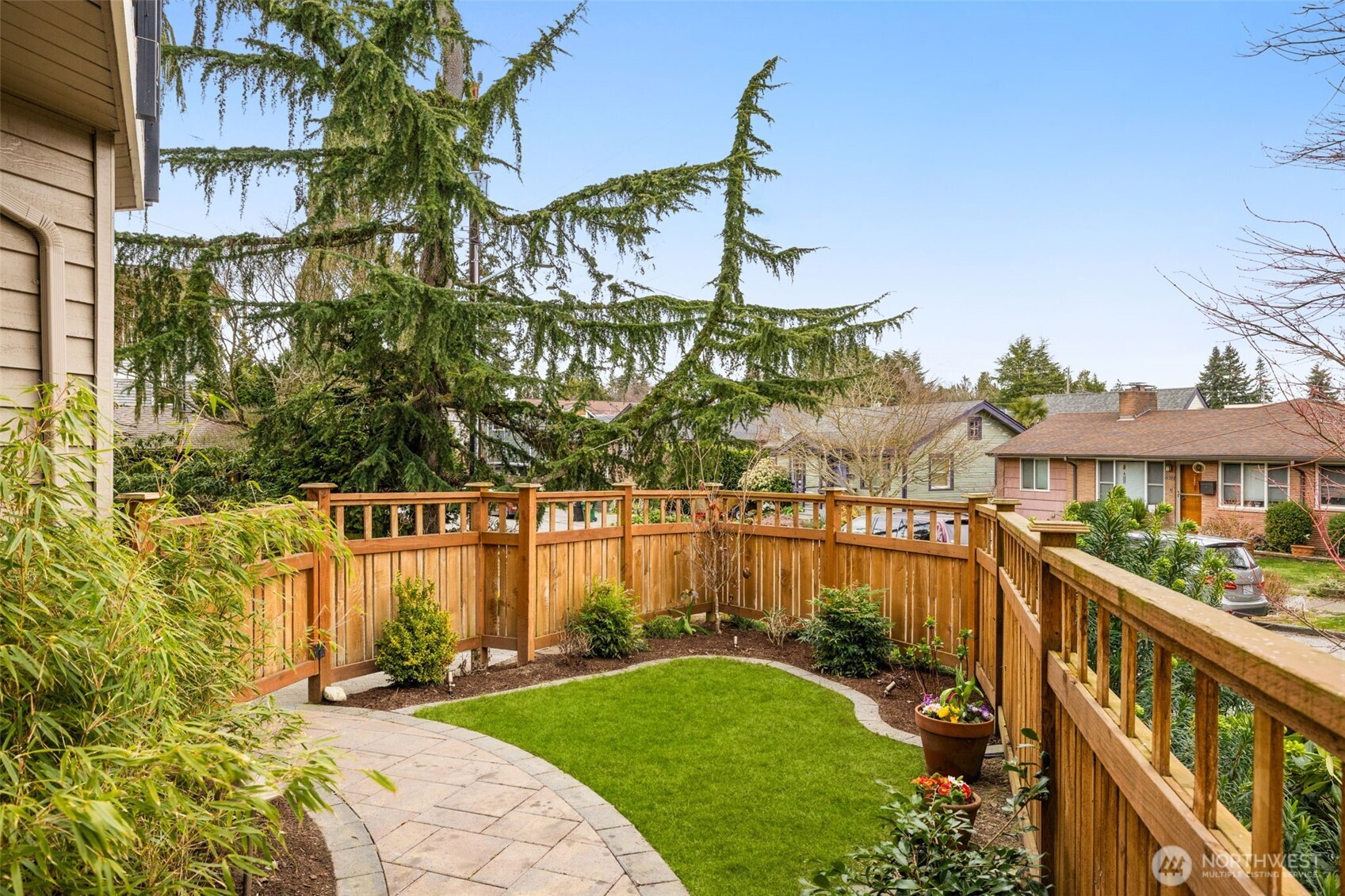 8360 Loyal Way Northwest Seattle, WA 98117 - Photo 32 of 36 a view of a garden with a house in the background