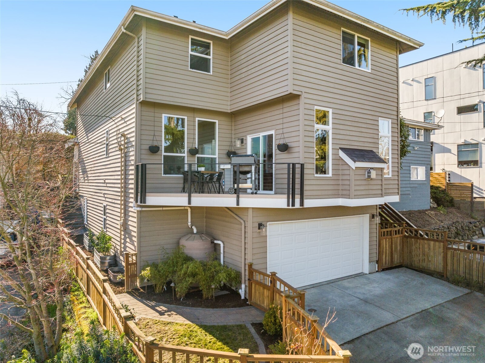 8360 Loyal Way Northwest Seattle, WA 98117 - Photo 33 of 36 a view of a house with backyard and sitting area