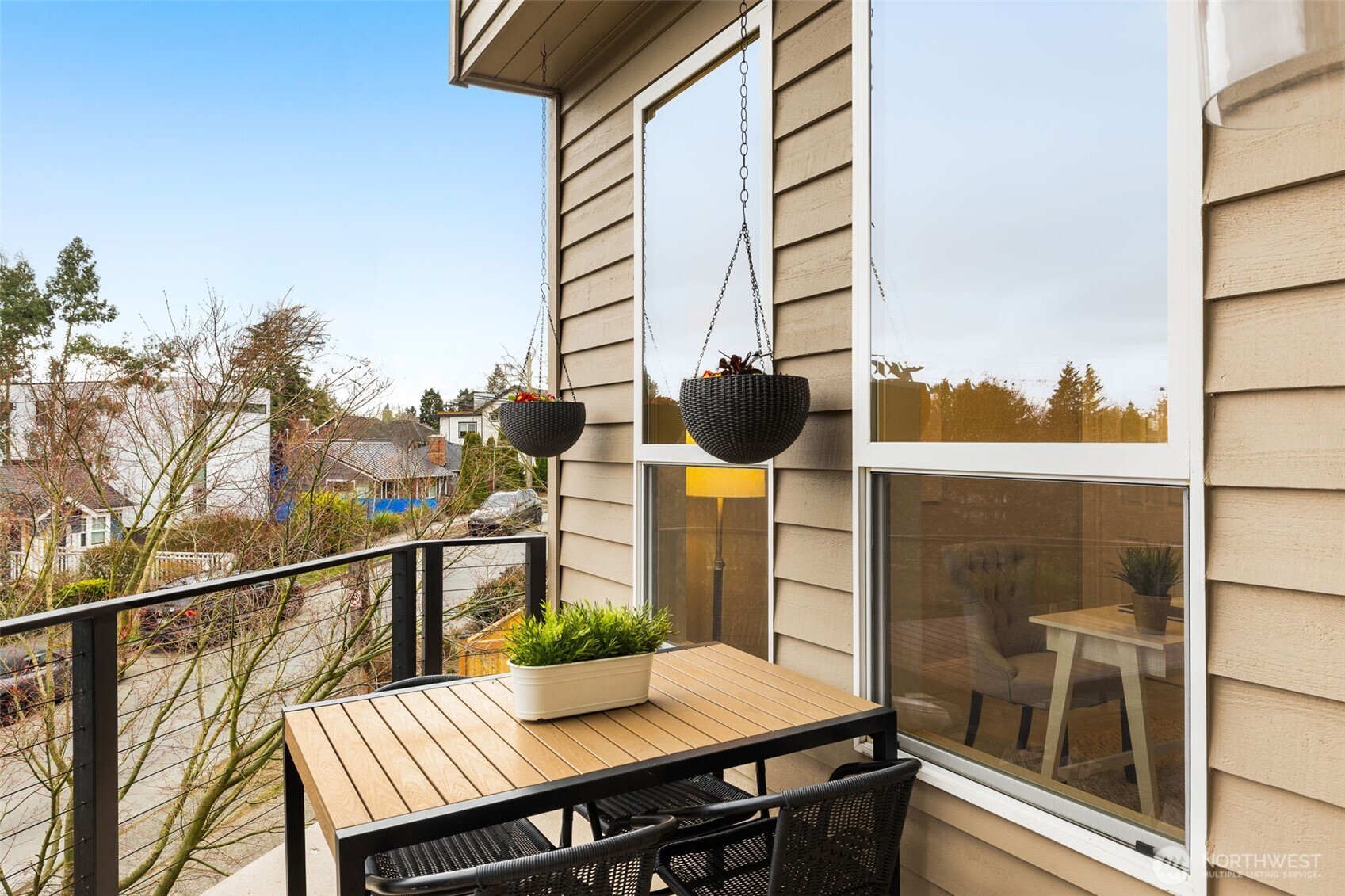 8360 Loyal Way Northwest Seattle, WA 98117 - Photo 9 of 36 a view of balcony with wooden floor and outdoor seating