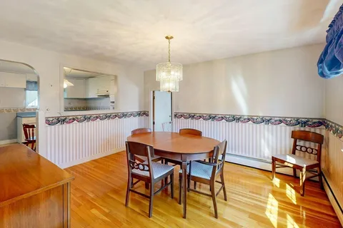 a dining room with a table and chairs
