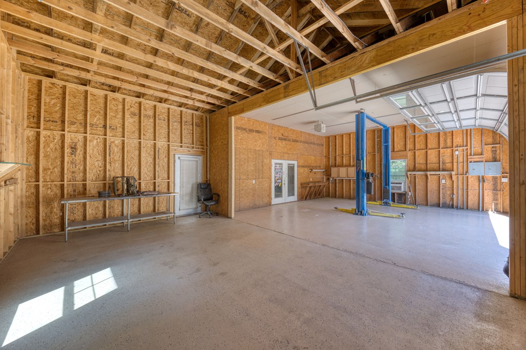 182 Oak Ridge Drive Waverly Hall, GA 31831 - Photo 17 of 52 a view of empty room with wooden walls