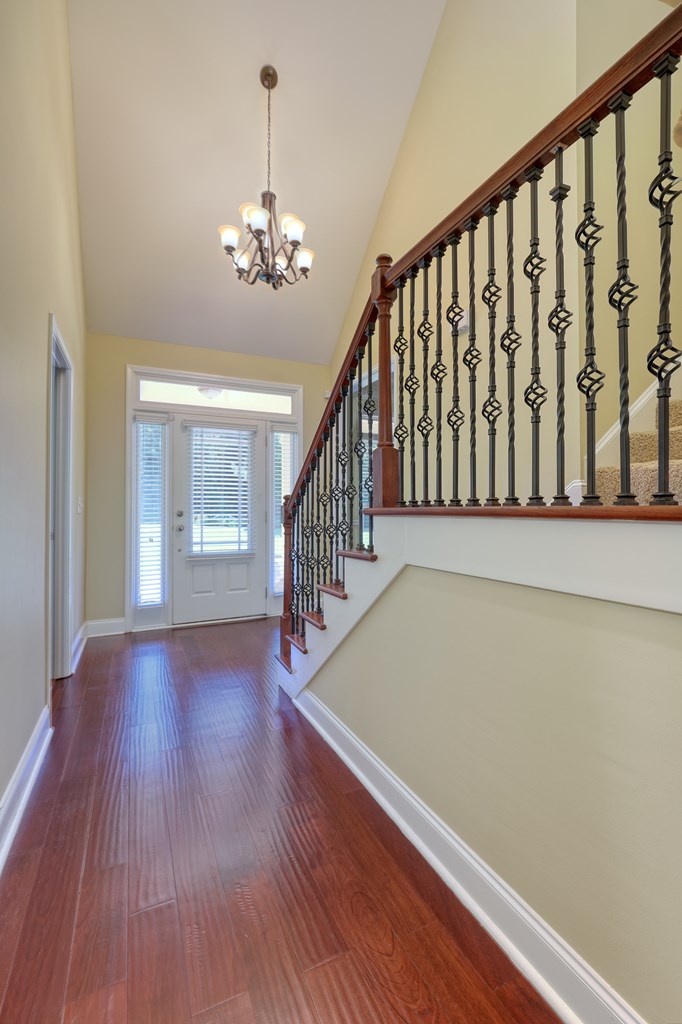 182 Oak Ridge Drive Waverly Hall, GA 31831 - Photo 20 of 52 a view of a room with wooden floor chandelier and windows