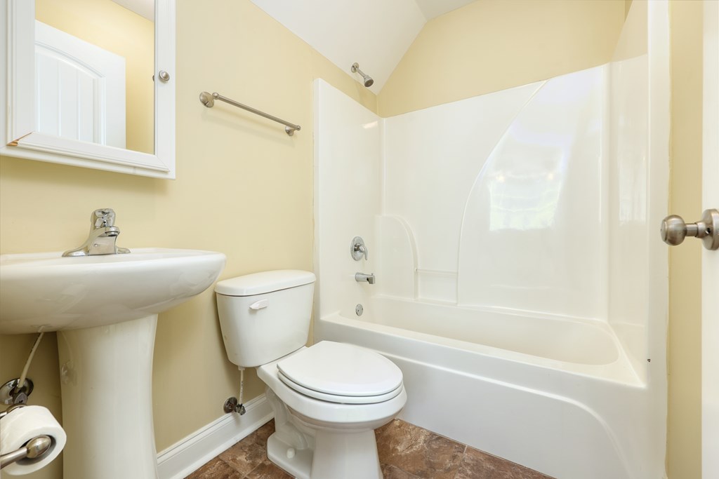 182 Oak Ridge Drive Waverly Hall, GA 31831 - Photo 45 of 52 a bathroom with a sink toilet and shower