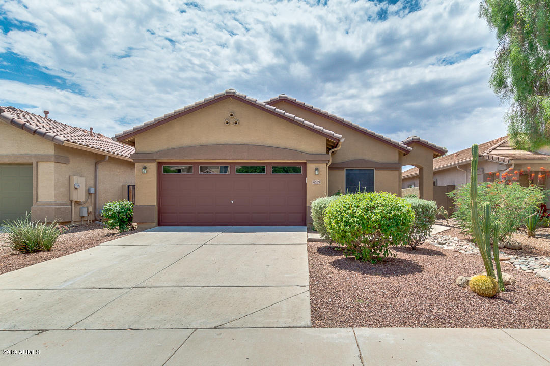 4559 West Cottontail Road Phoenix, AZ 85086 - Photo 1 of 23 a front view of a house with garden