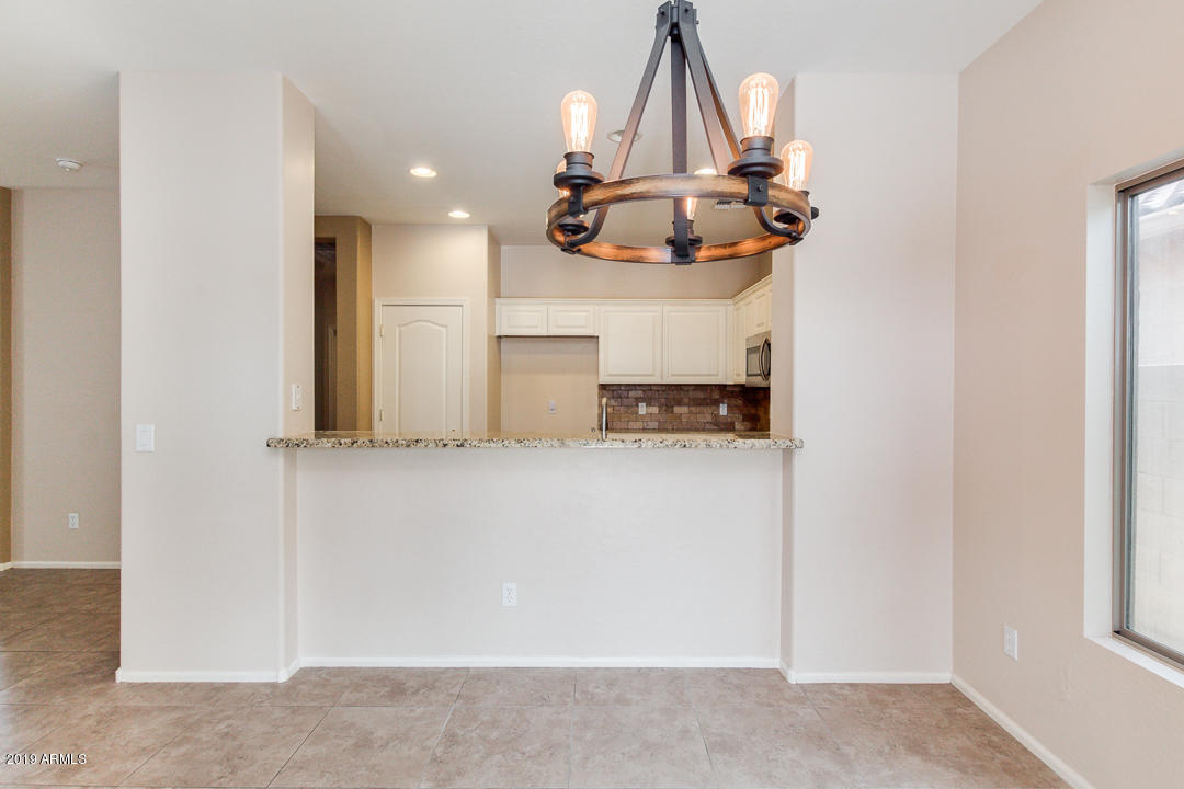 4559 West Cottontail Road Phoenix, AZ 85086 - Photo 8 of 23 a view of kitchen with furniture and cabinets