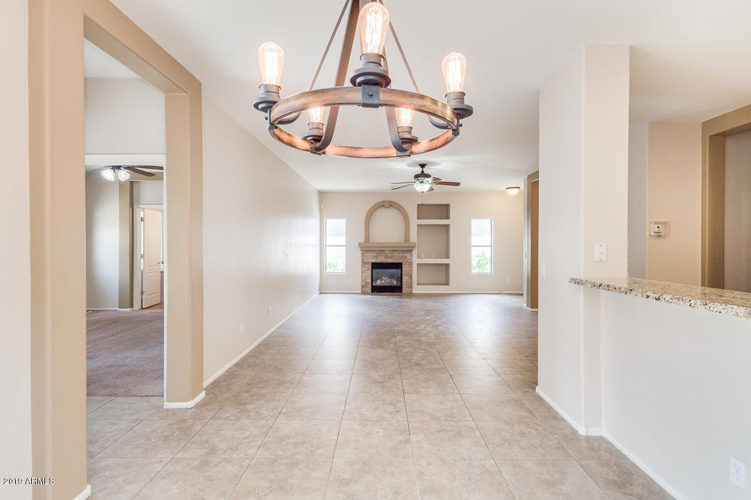 4559 West Cottontail Road Phoenix, AZ 85086 - Photo 9 of 23 a view of a livingroom with a fireplace and window