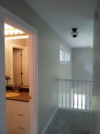 a view of an entryway with wooden floor