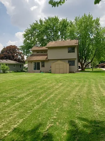 a view of a house with a yard