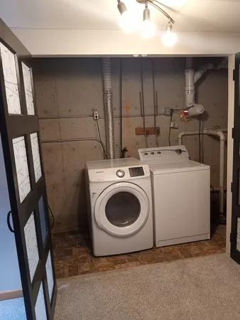 a utility room with dryer and washer
