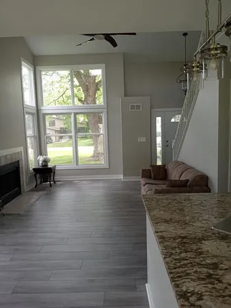 a view of a living room and hardwood floor